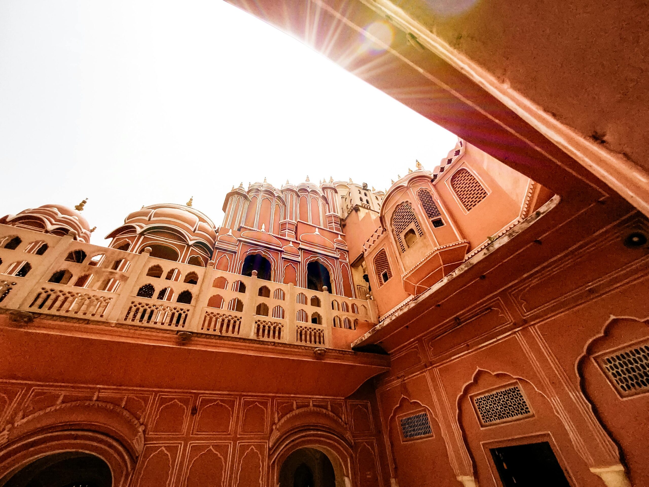 Pink City,Low angle view of Hawa Mahal, showcasing its rich Rajput architecture in Jaipur, India.