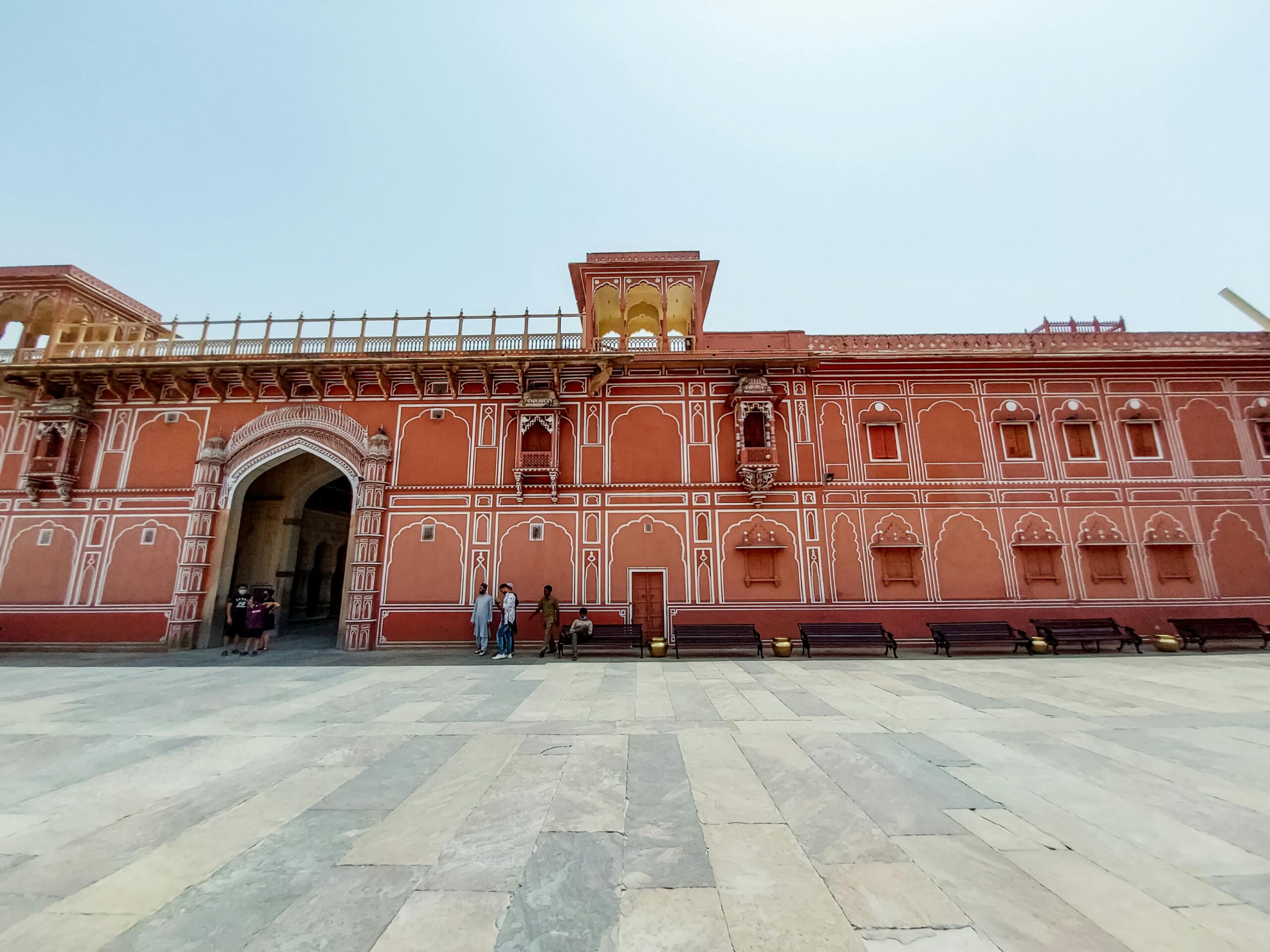 Explore the vibrant pink facade of City Palace, Jaipur's iconic landmark, reflecting rich Rajasthani architecture.