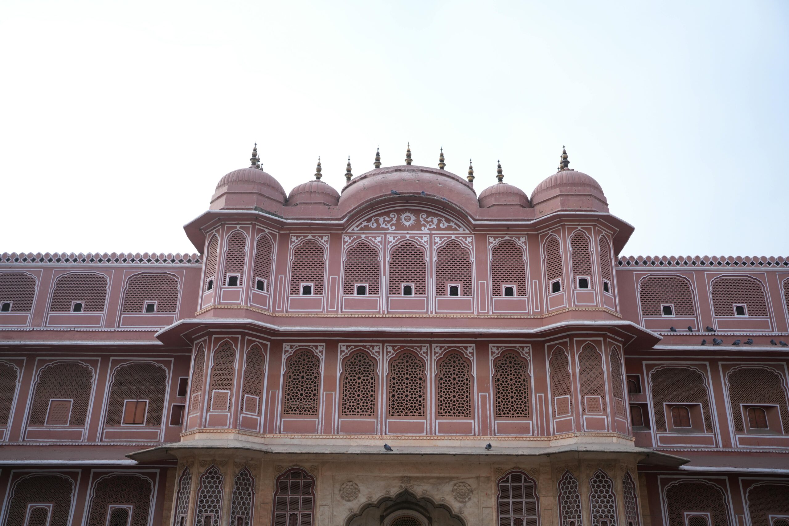 City Palace Jaipur,Front view of the iconic architecture of Jaipur Fort, showcasing detailed design and vibrant colors.
